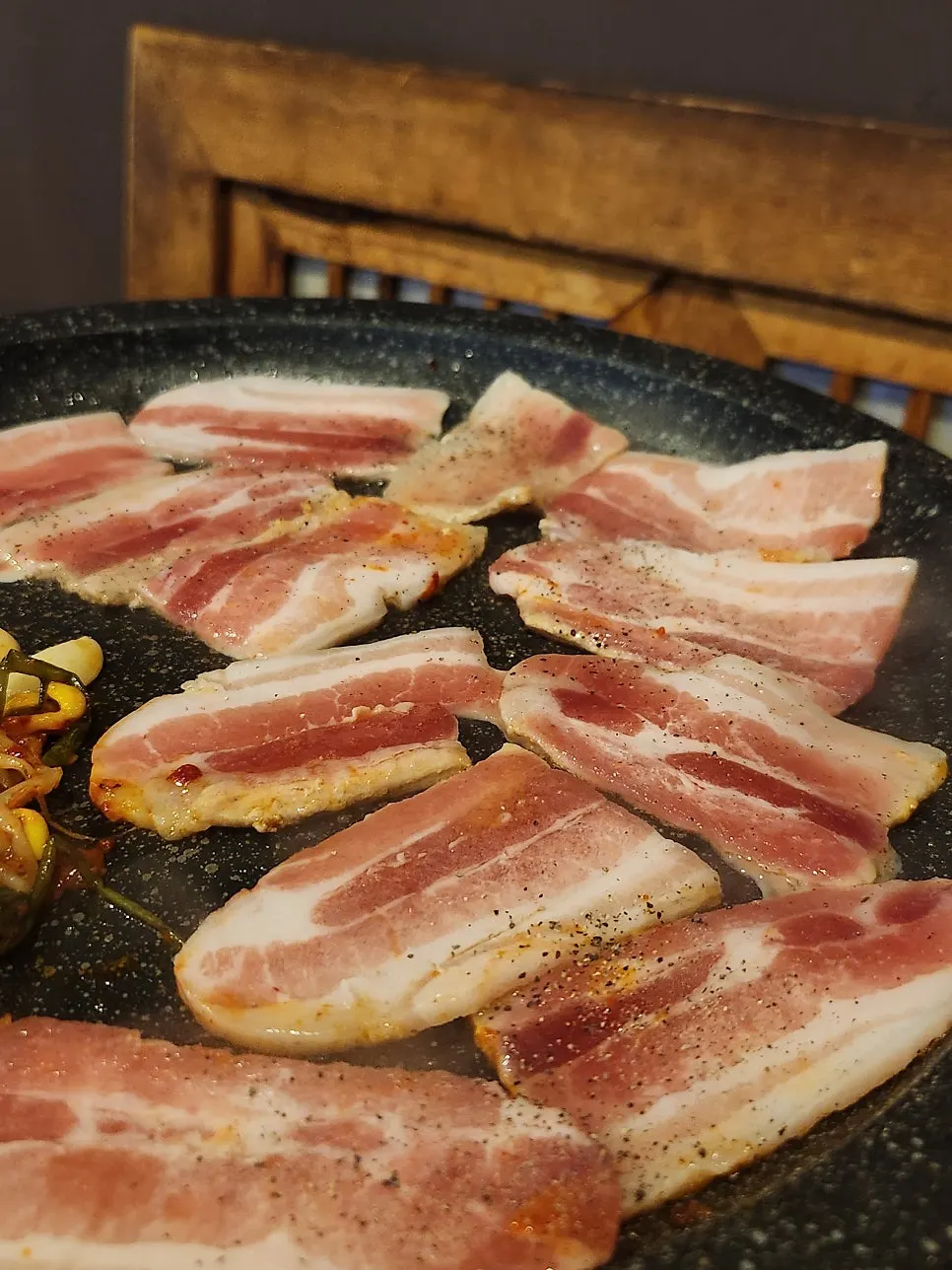 Remaining pork belly added to the grill