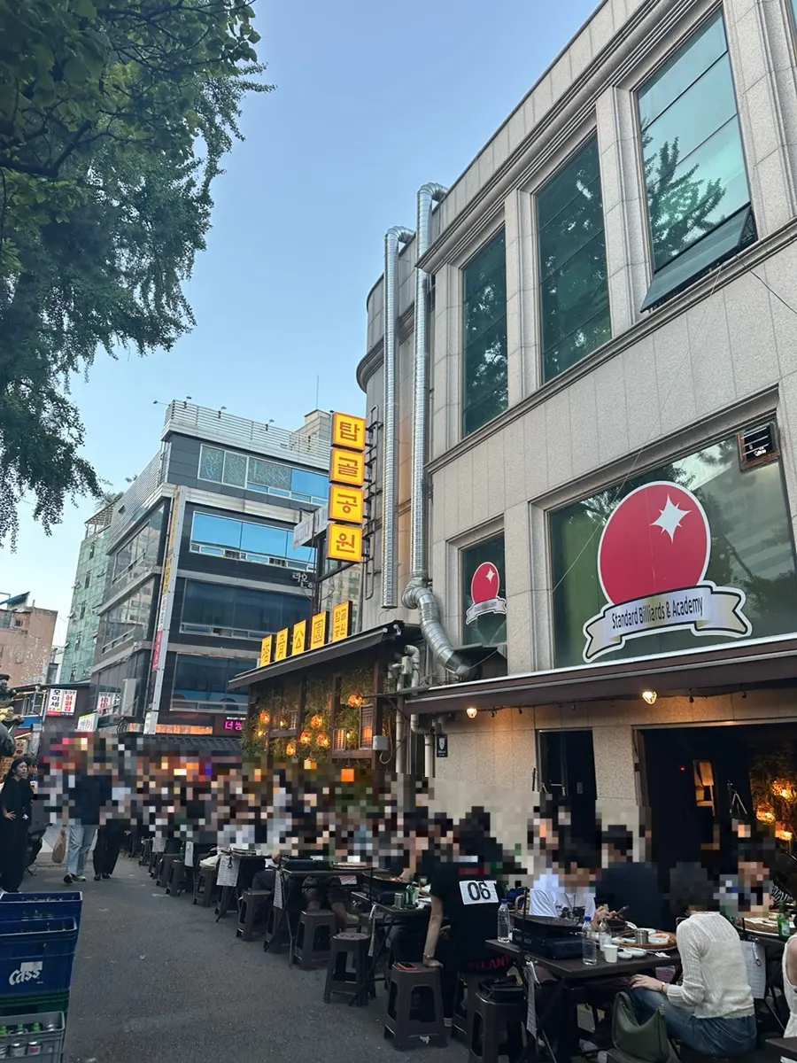 Evening view of seating in the outdoor dining alley in Jongno 3-ga