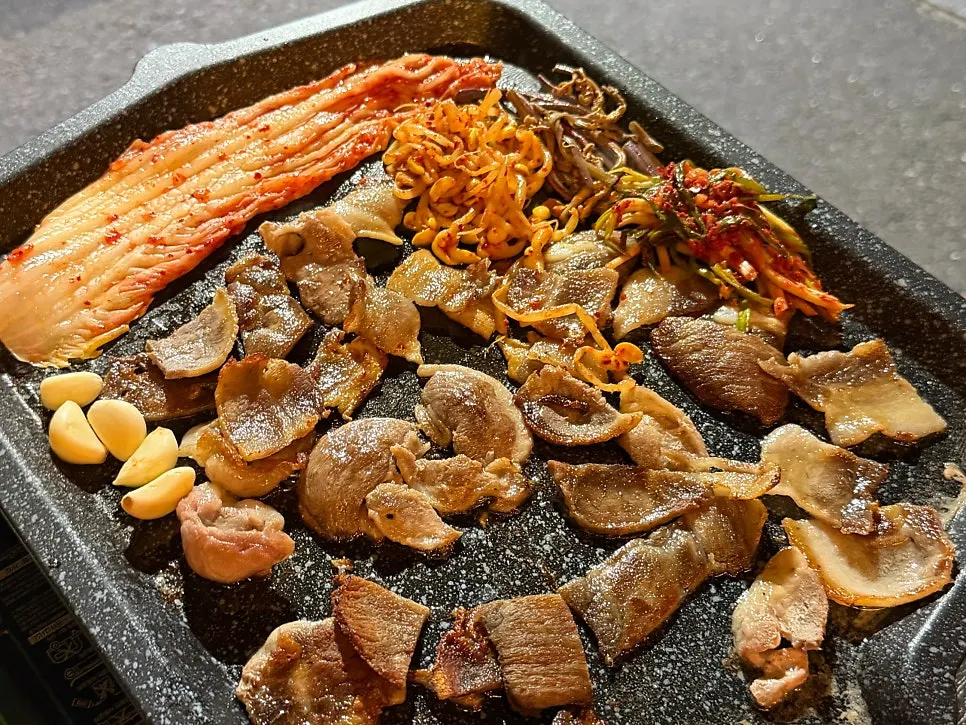 Close-up of the grill pan in the Jongno 3-ga outdoor BBQ atmosphere