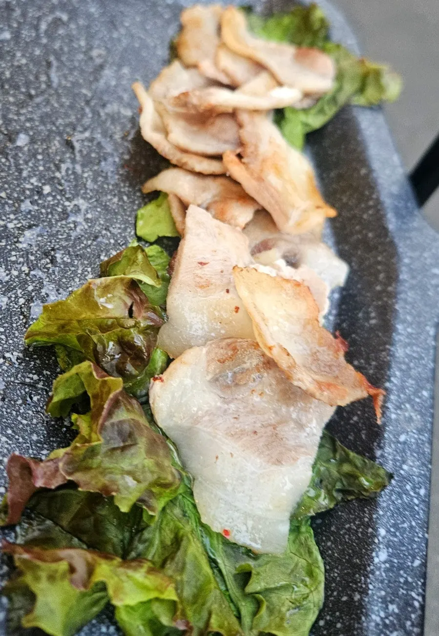 Sliced grilled frozen pork belly