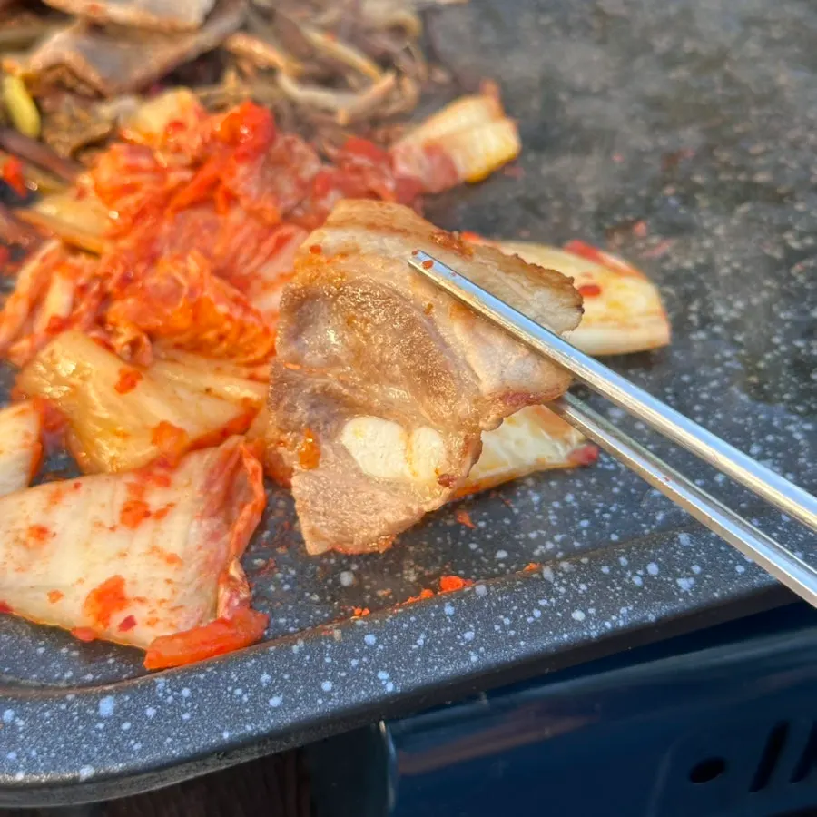 Kimchi cooking in the meat drippings