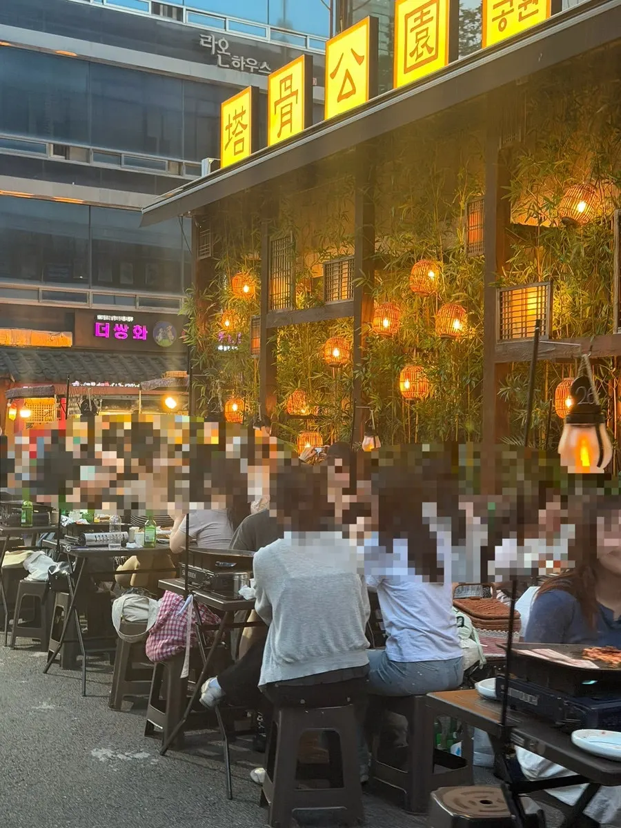 Restaurant exterior with soft lighting and bamboo decorations
