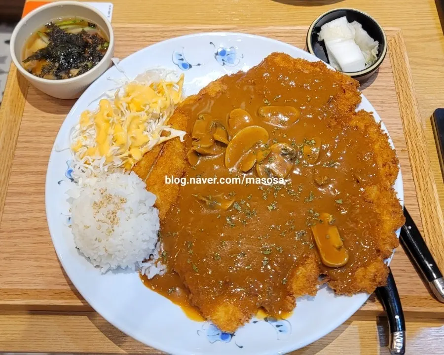 A plate of the surprisingly huge hyeja king pork cutlet