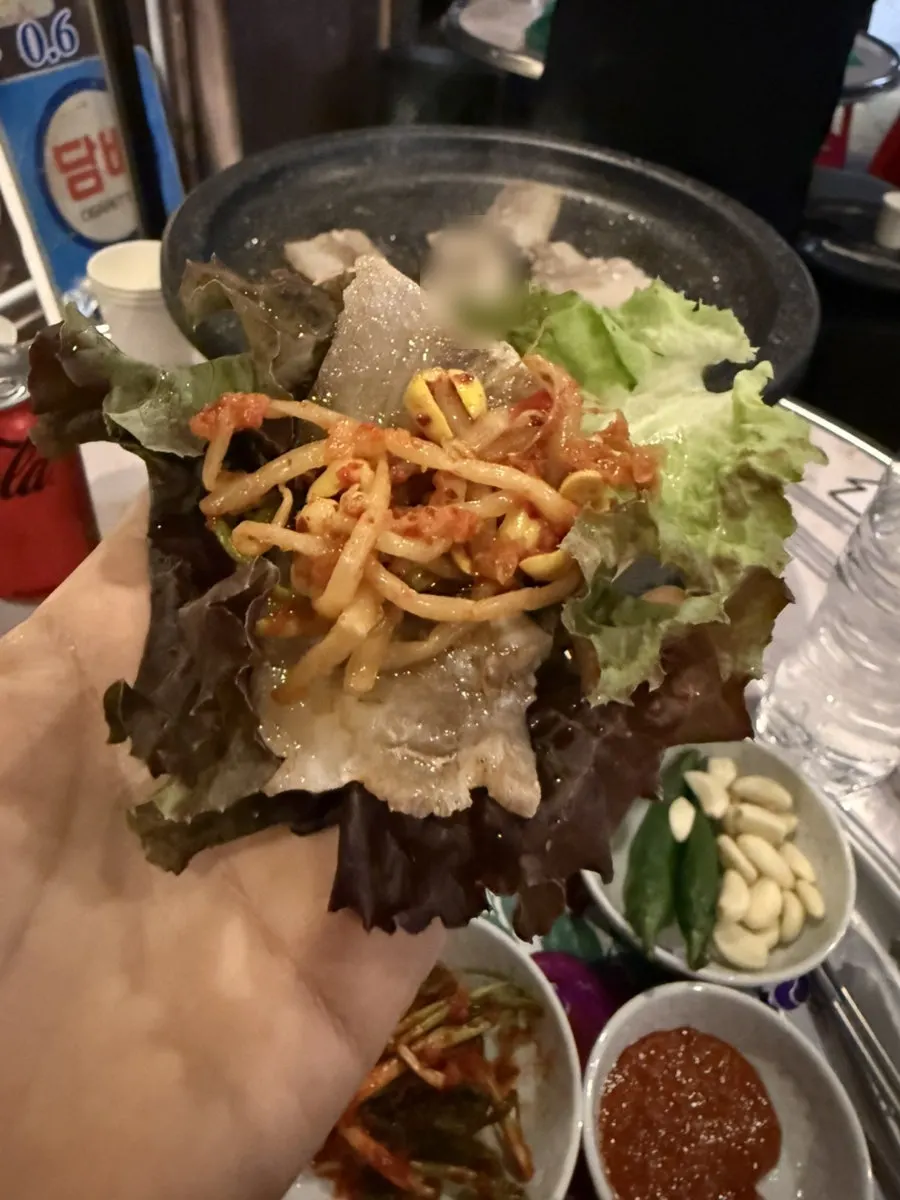 A piece of frozen pork belly and the outdoor table