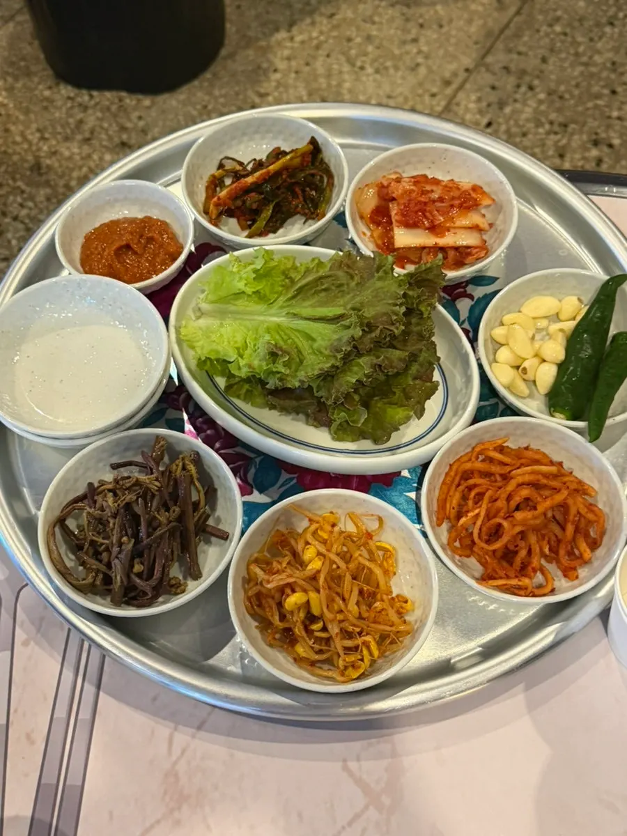 Basic side dishes with lettuce and namul served at Chowon Restaurant