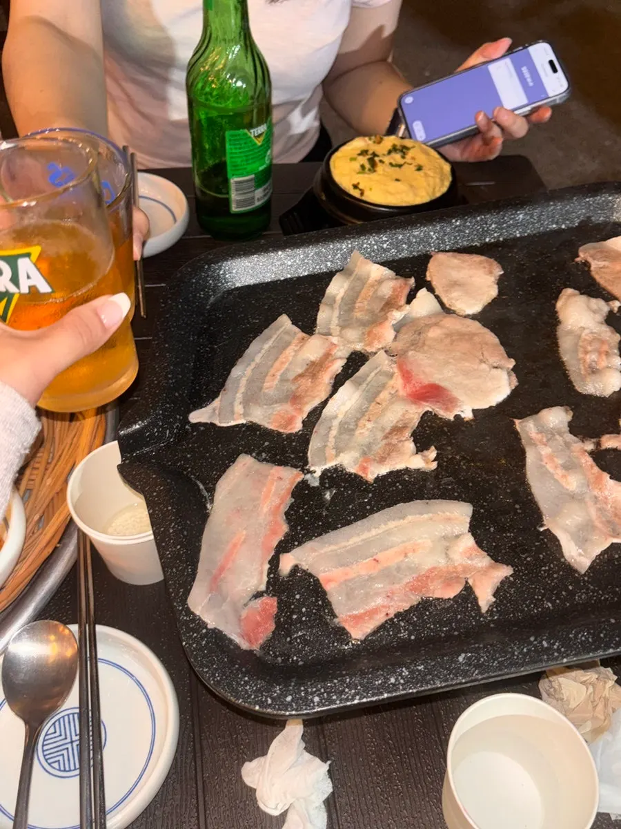 Fully cooked pork belly and side dishes on the yajang table