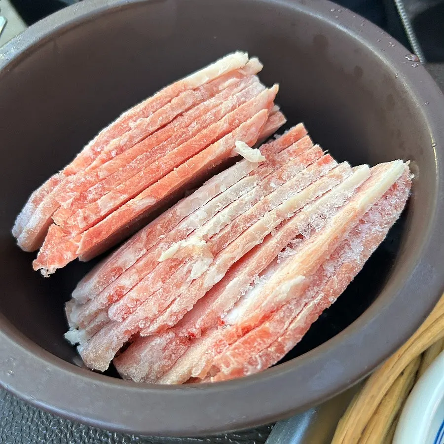 Table setting before grilling flash-frozen pork belly