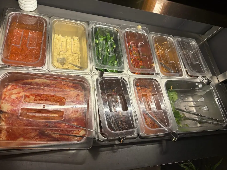 Self-serve bar with ssam greens and side dishes
