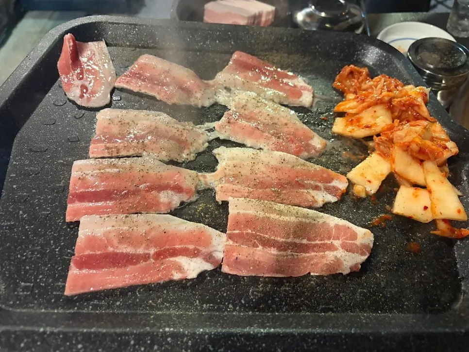 Pork belly cooking with kimchi