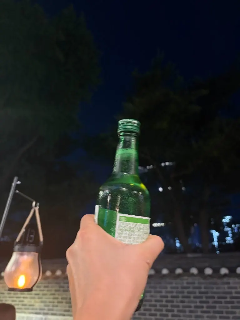 Soju enjoyed at an outdoor dining table