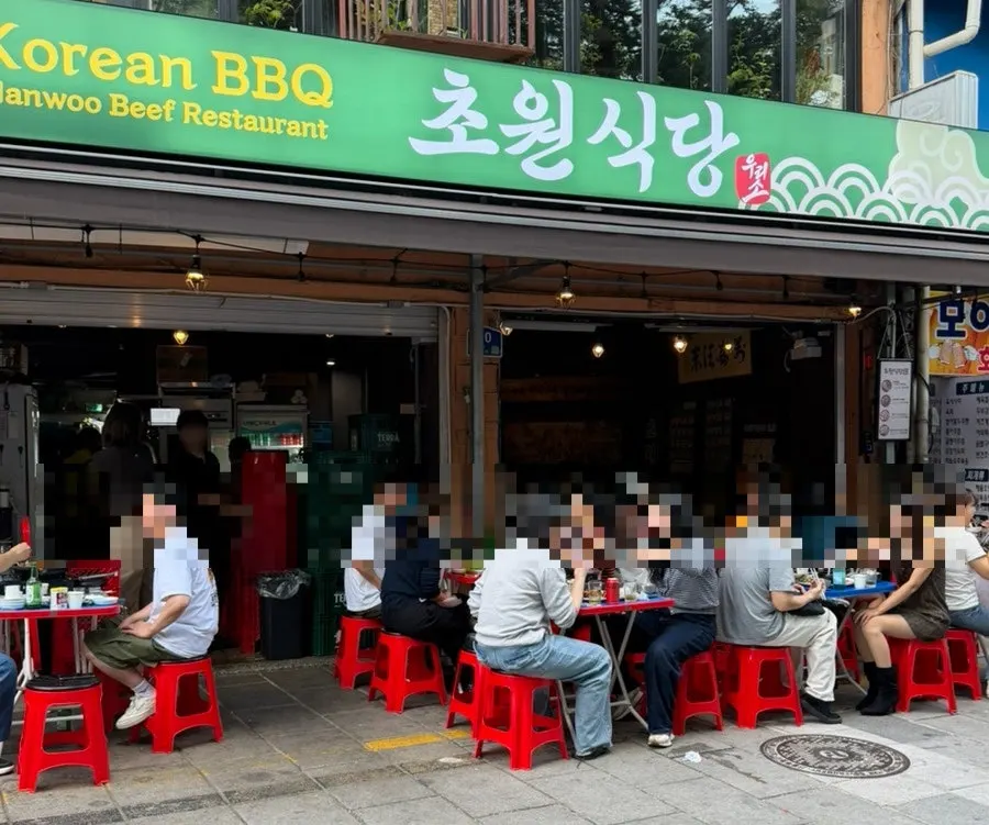 Overview of Chowon Restaurant's outdoor tent tables in Jongno 3-ga