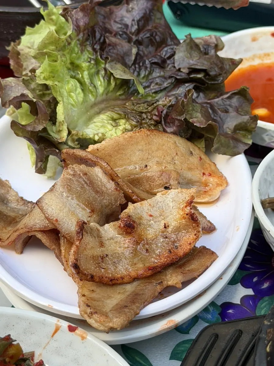 A crisply grilled bite of frozen pork belly