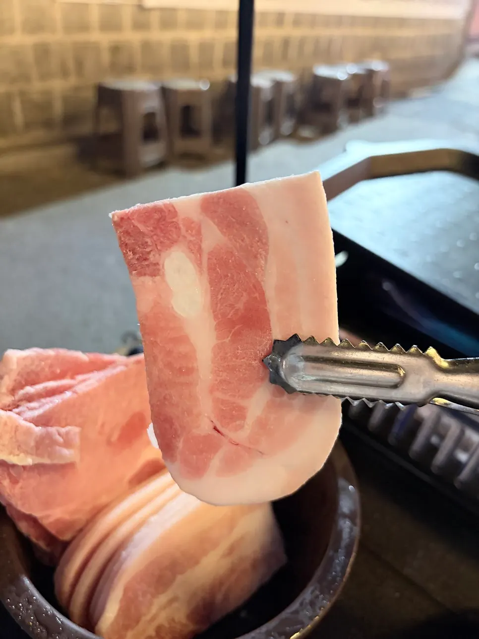 Frozen pork belly and sides on the grill