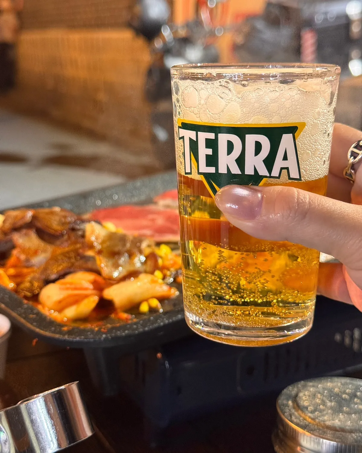 A glass of beer served with the meat