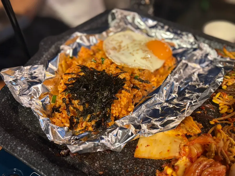 Fried rice topped with a runny sunny-side-up egg