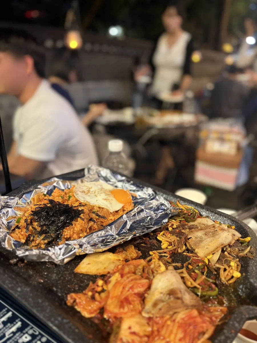 Fried rice alongside remaining side dishes