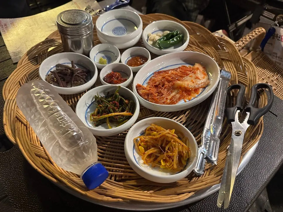 Basic banchan spread of bracken fern, kimchi, bean sprouts, and green onion kimchi