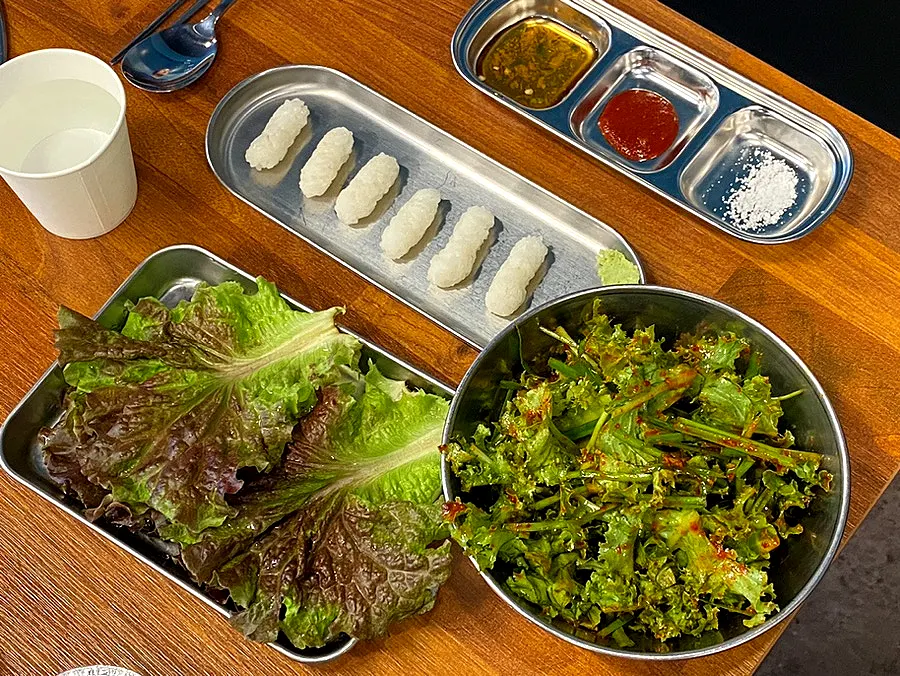 A tray of side dishes set out after ordering