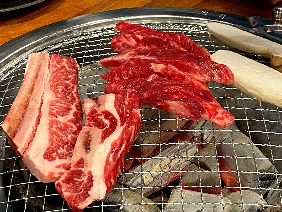 Udaegalbi and galbisal placed on the grill first