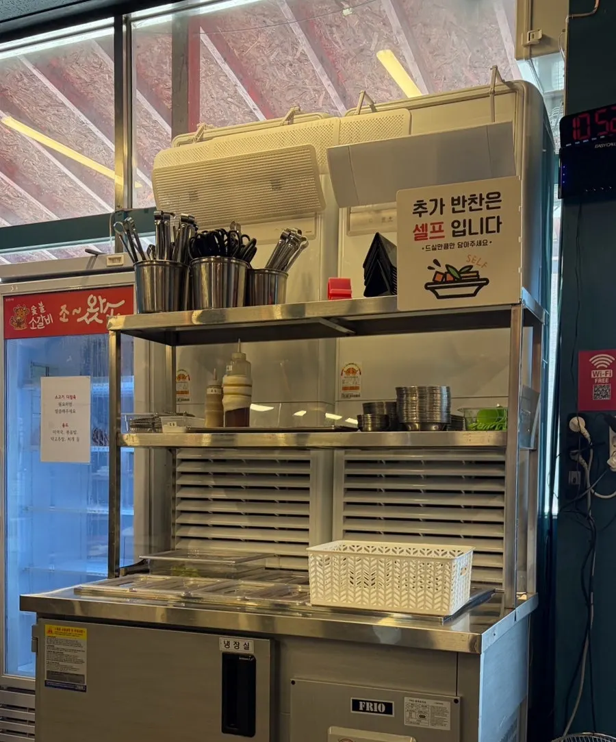 Sauces and side dishes at Jowatso's entrance self-serve corner