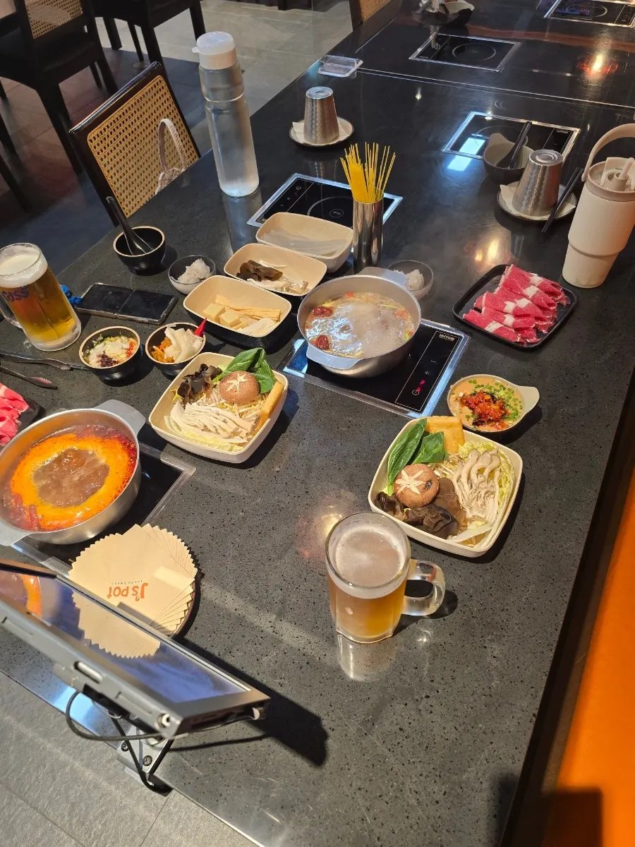 Full table set for two with hot pot sets and draft beer