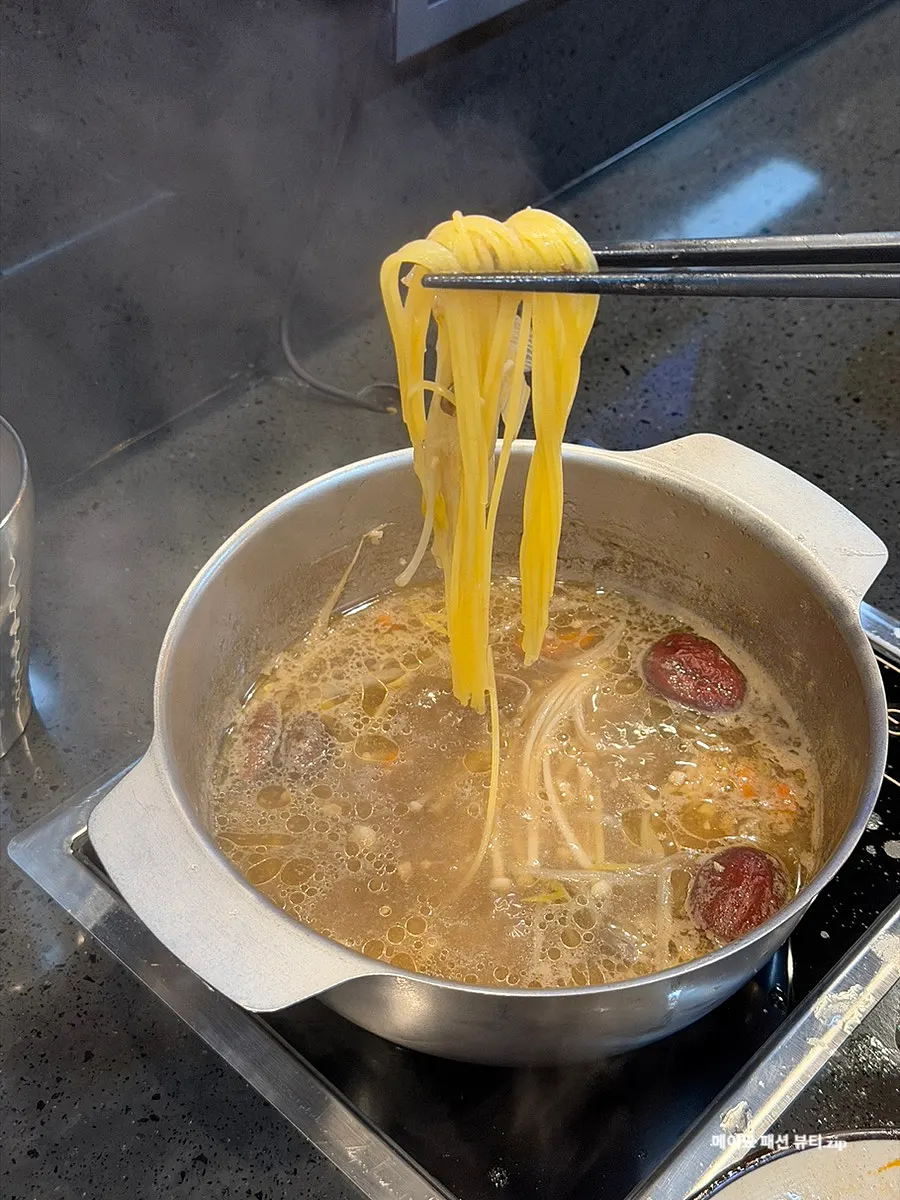 A bite of corn noodles boiled in the broth
