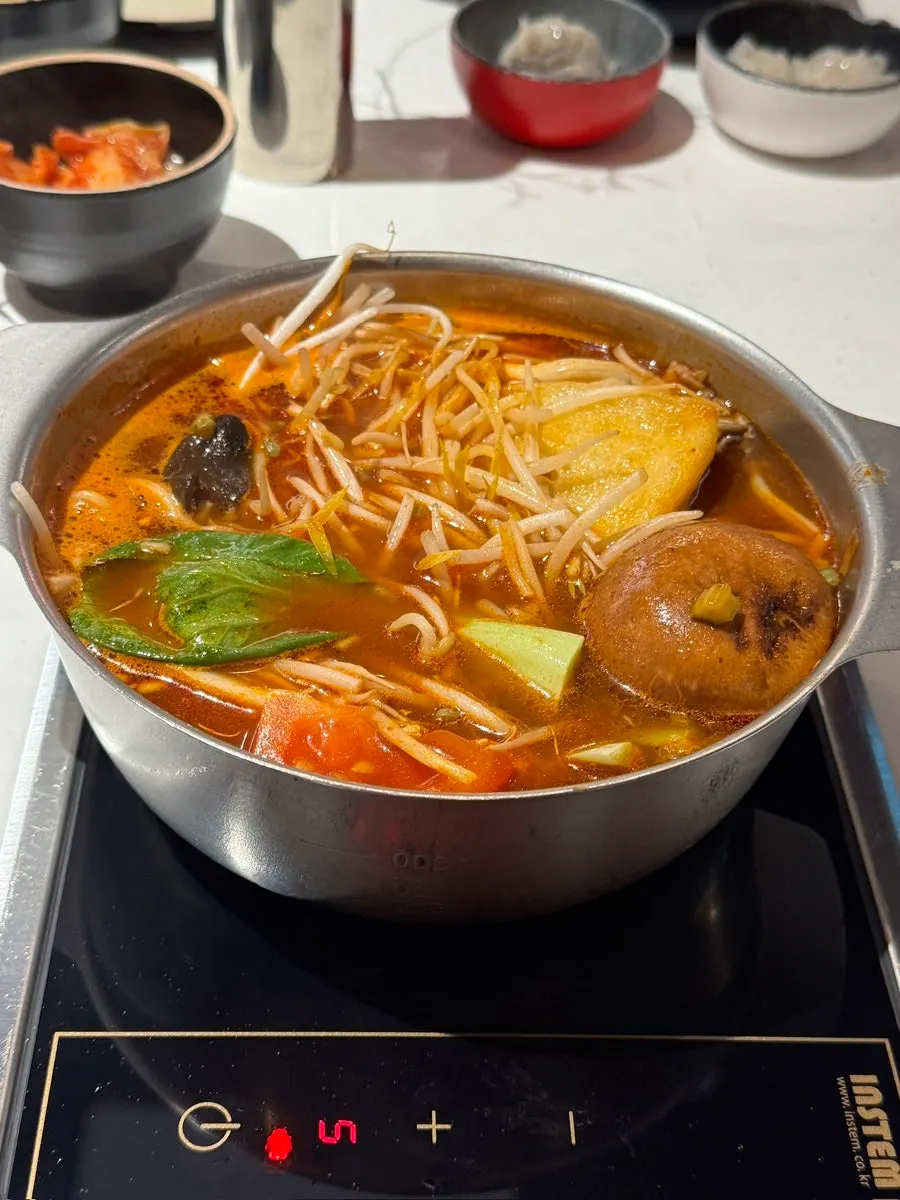 Vegetables and meat cooking in the hot pot