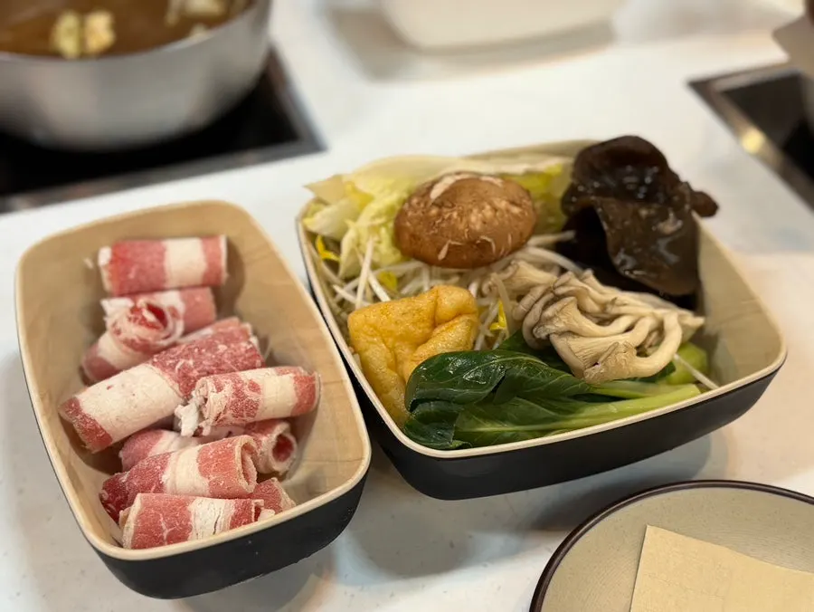 Lunch set table setting with assorted vegetables and beef brisket
