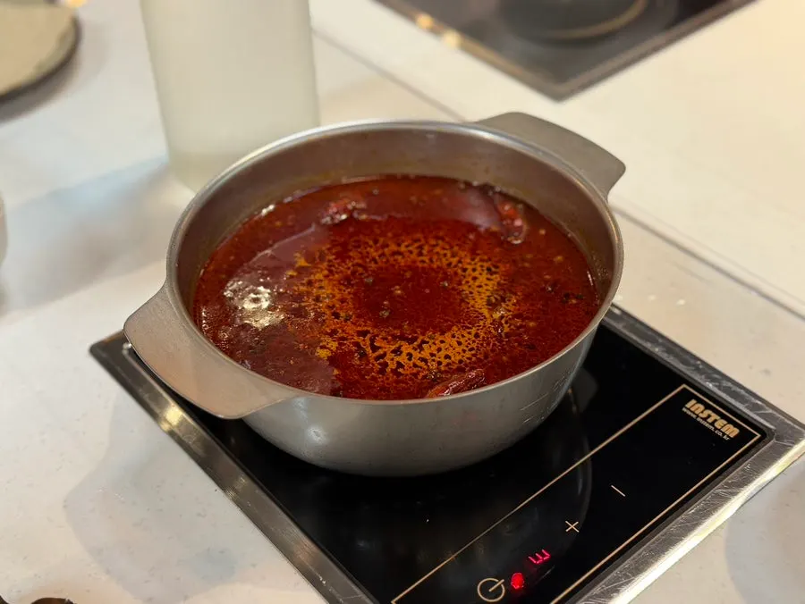 J's Pot hot pot simmering in a personal pot