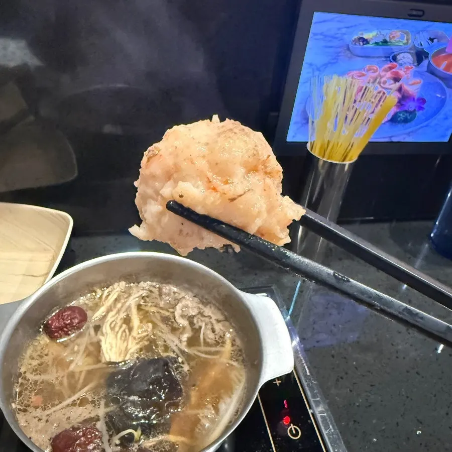 Beef cooking in the clear broth