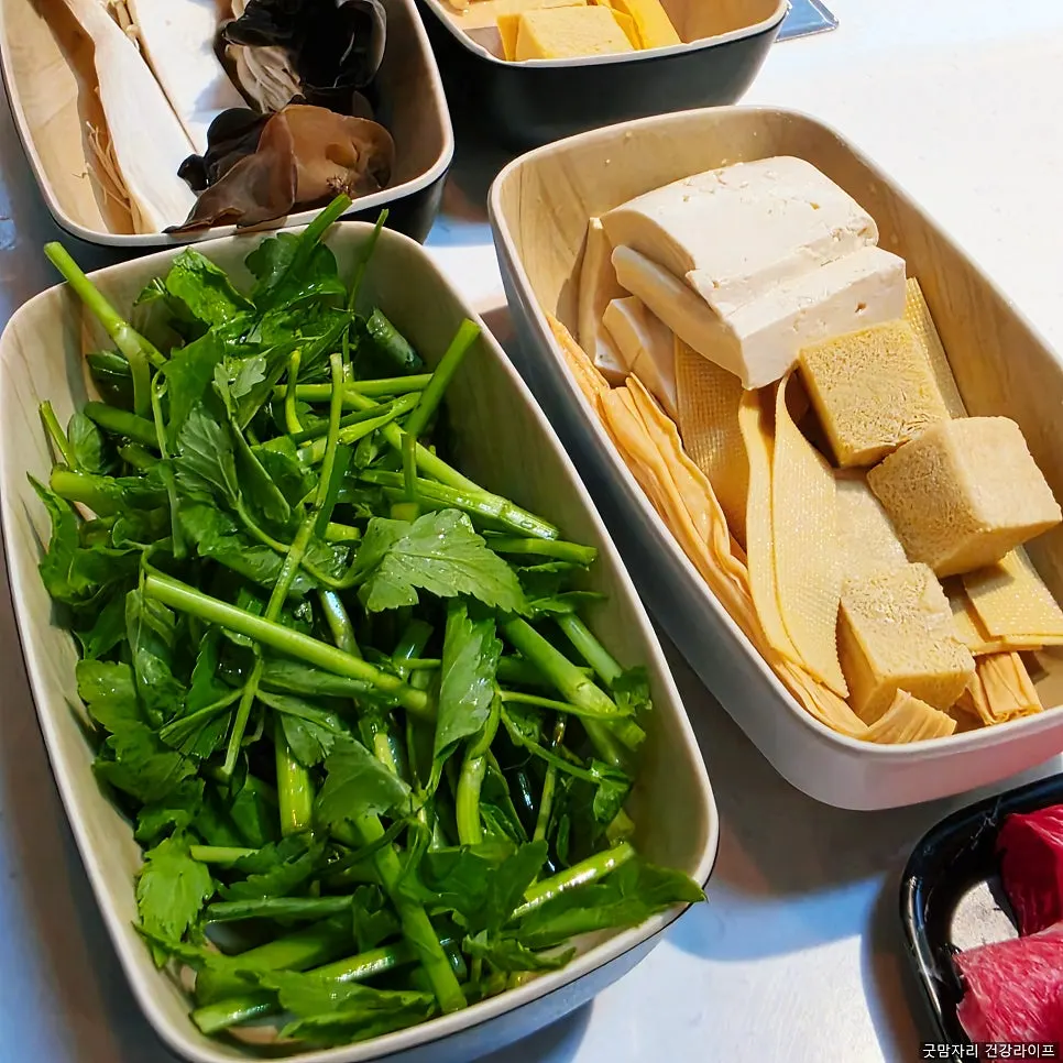 Adding ingredients to the mala broth