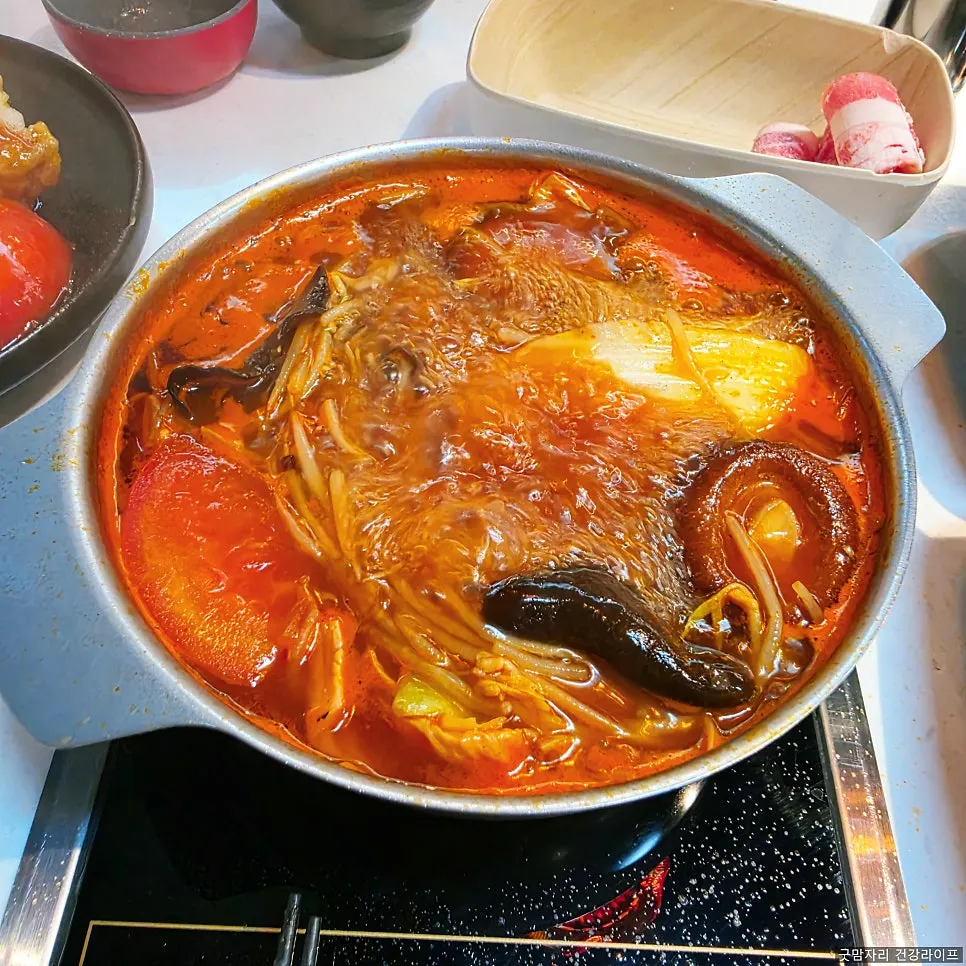 Hot pot broth and ingredients at J's Pot Magok Branch