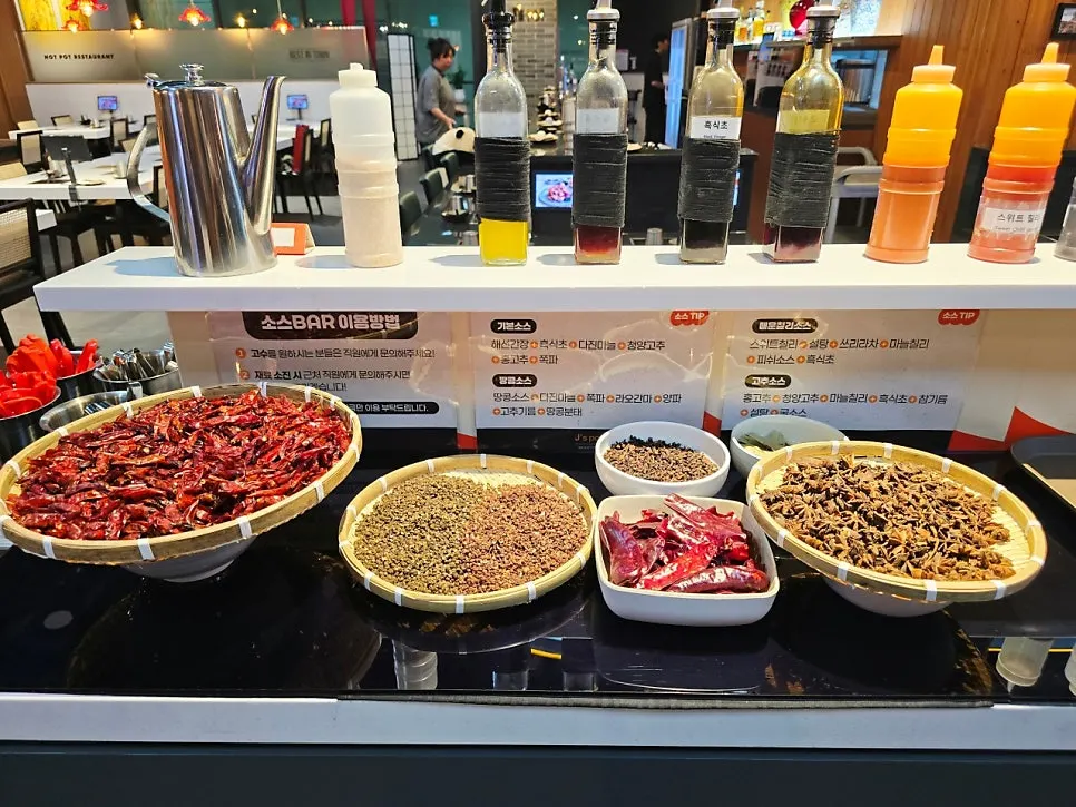 Peanut sauce scooped from the sauce bar