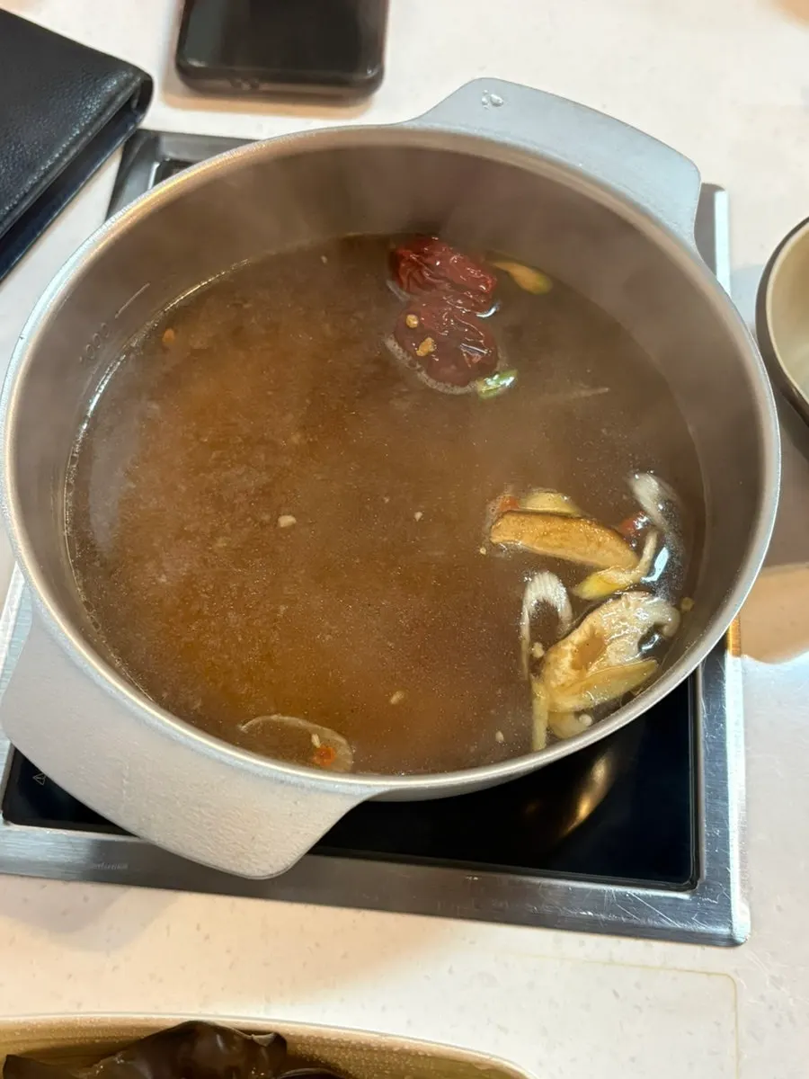 Fully set personal hot pot with ingredient plates