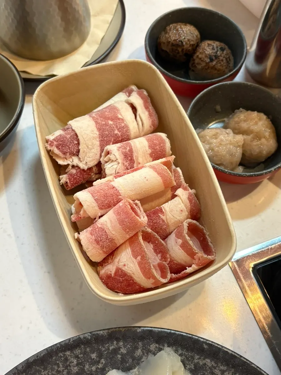 Hot pot simmering with vegetables and mushrooms