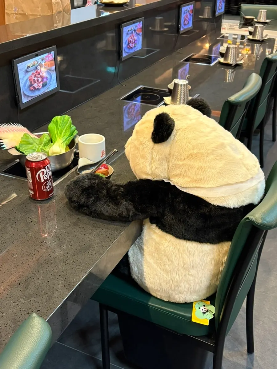 Panda character decoration that looks like it's eating hot pot