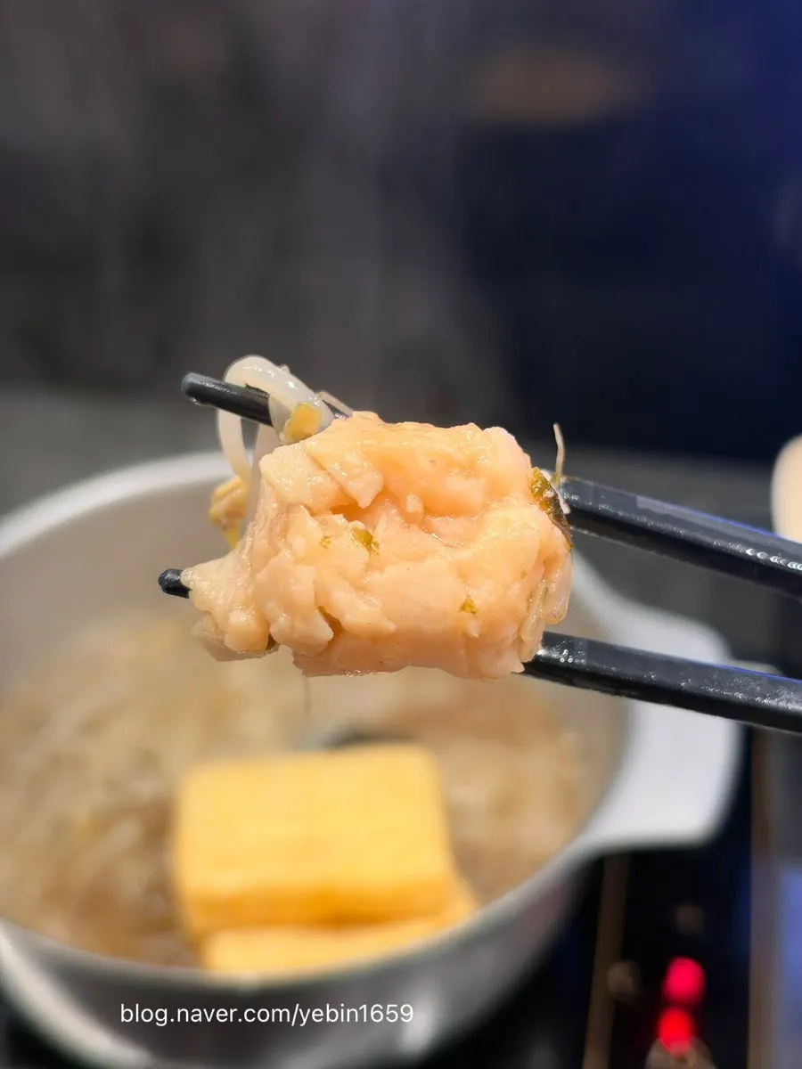 Bouncy fish balls added to the pot