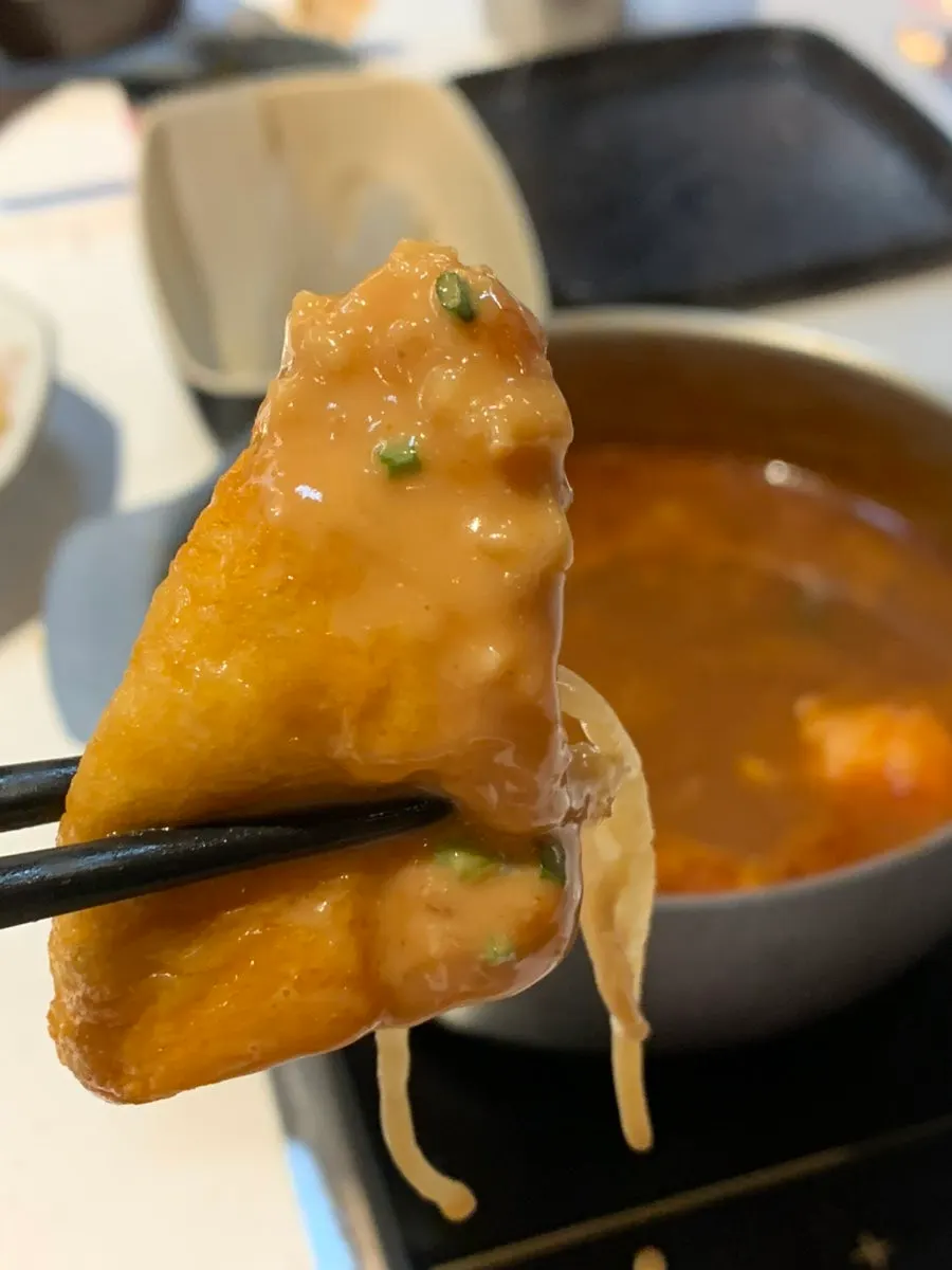 Fried tofu pockets soaked in broth