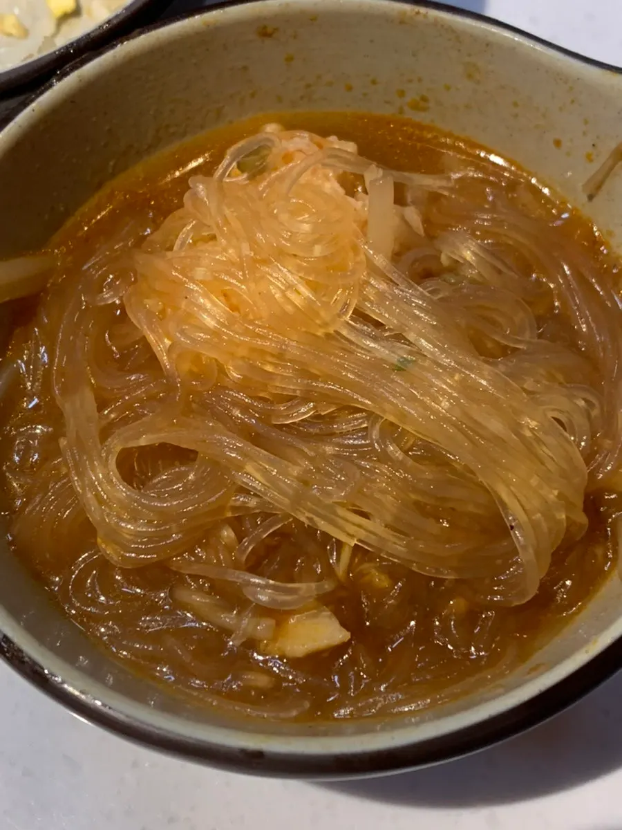 Flat glass noodles from mala broth and thin glass noodles from tomato broth