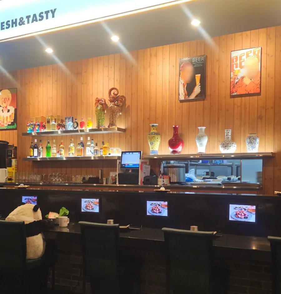 Bar seating for solo hot pot with a panda plush