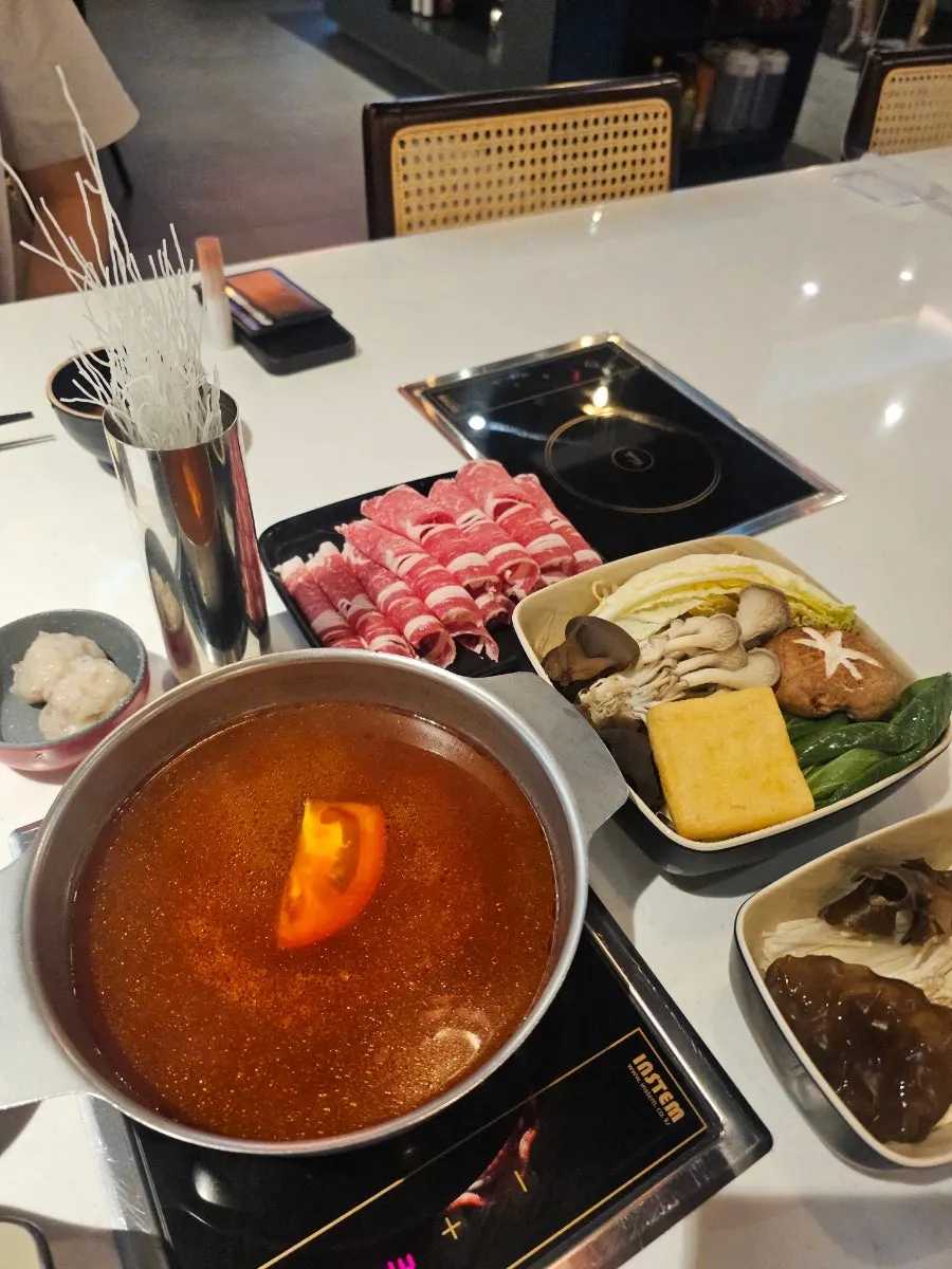 Set-up hot pot and side dishes on the table