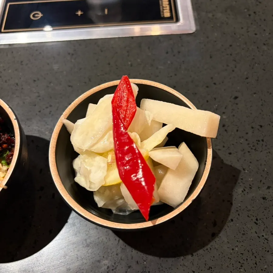 Pickles and cilantro from the sauce bar