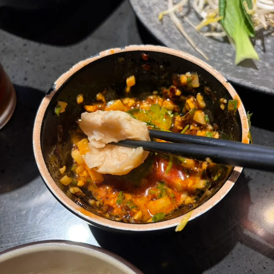 A bowl of thick peanut and lao gan ma sauce