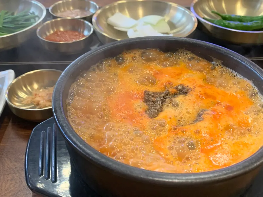 Spicy special gopchang sundae soup and set spread