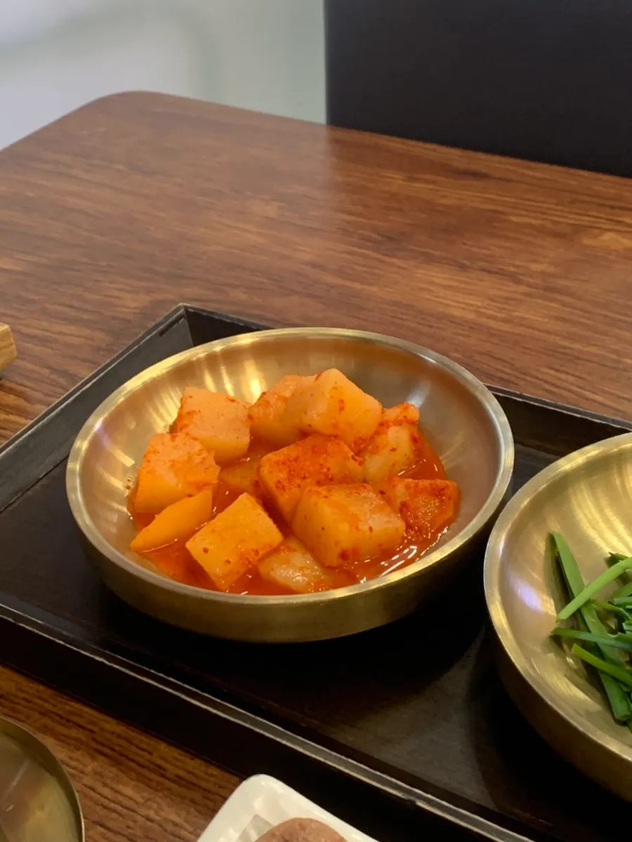 Table spread heaped with gopchang and suyuk