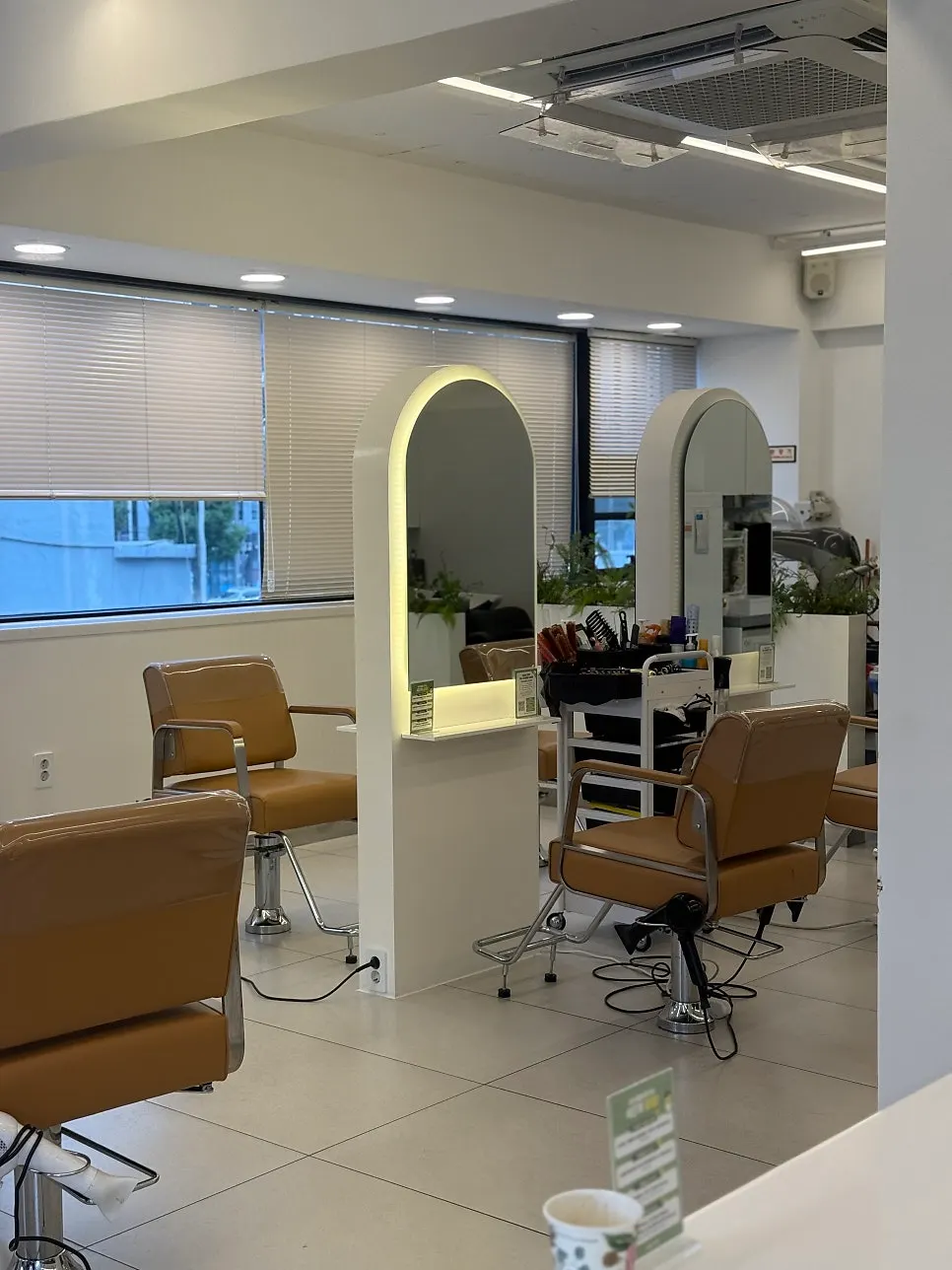 Salon interior in white and wood tones
