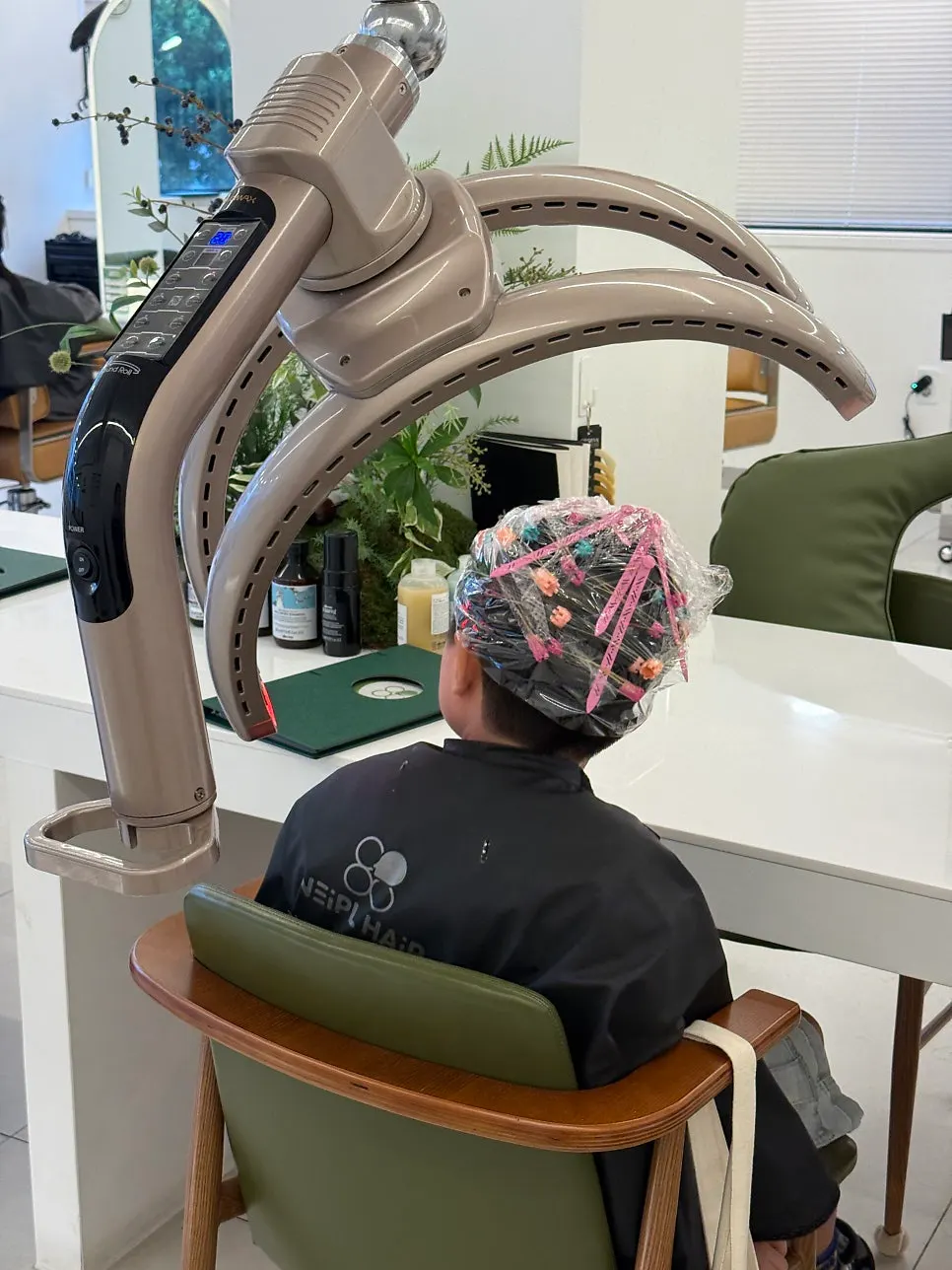 Rolling the hair onto shadow perm rods