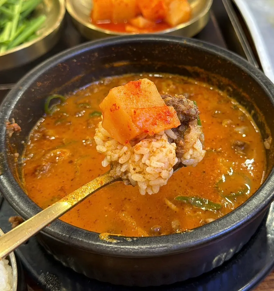 Rice mixed into the spicy sundaeguk broth