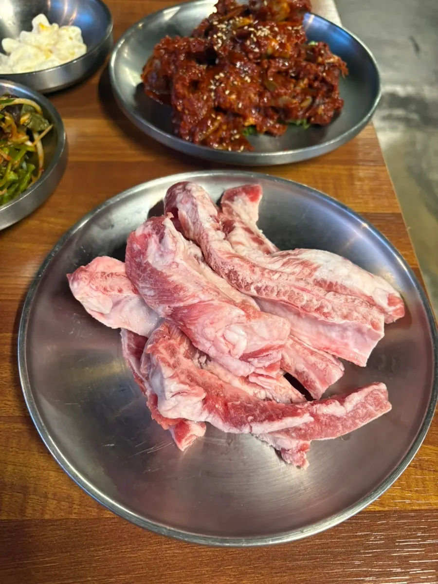 Table of side dishes set out after booking via Naver Reservation at Jugeokjip