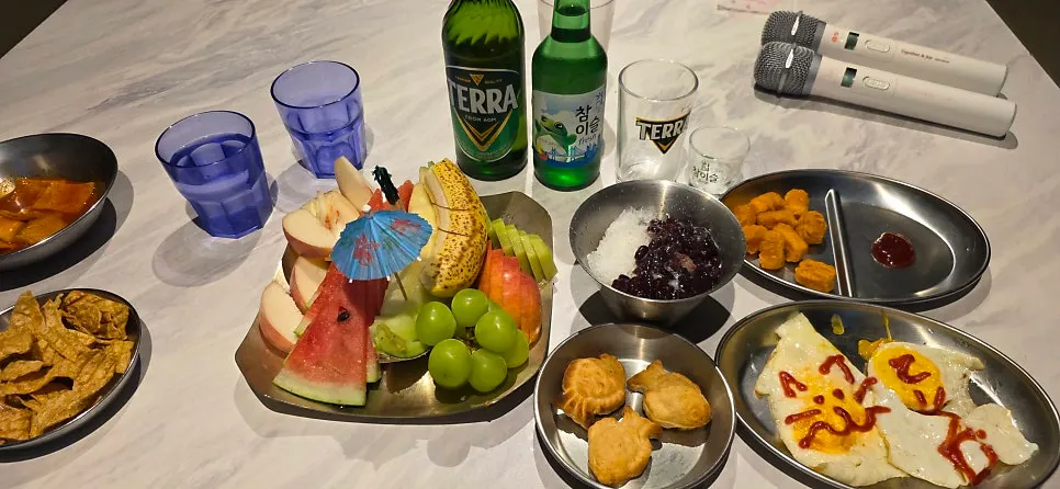Plate of seasonal fruit with watermelon, melon, and green grapes